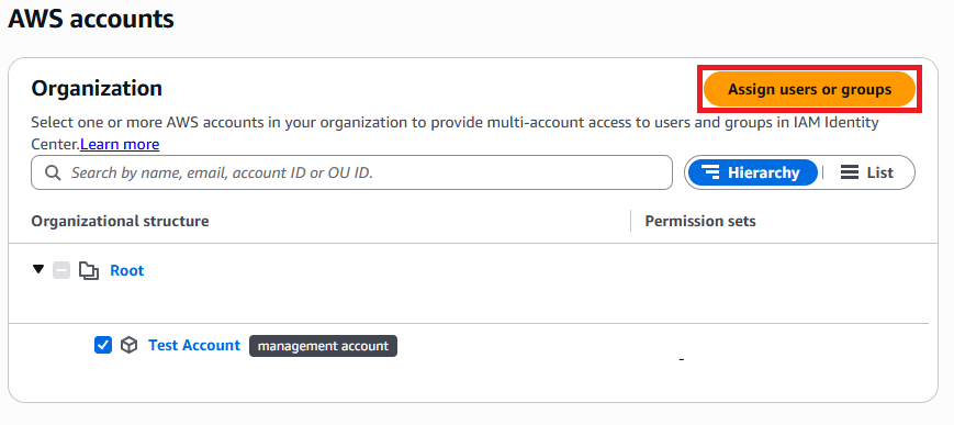 The "AWS accounts" page with the "Assign users or groups" button highlighted.